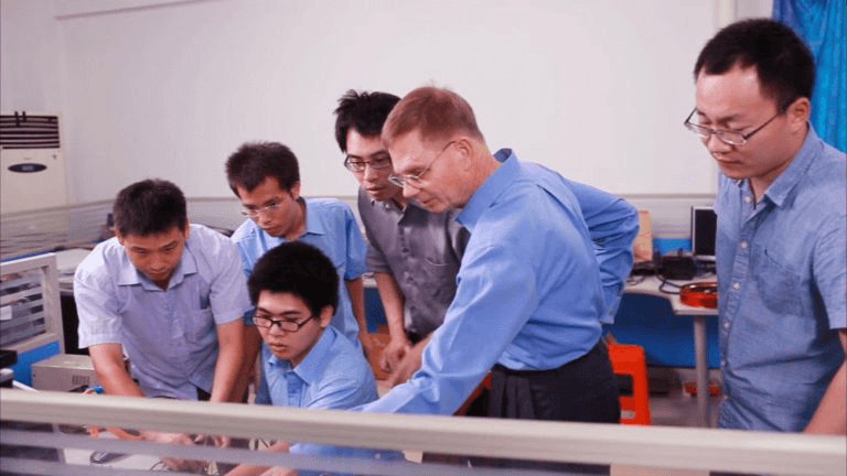 EnergyCite engineering and research team collaborating in the lab